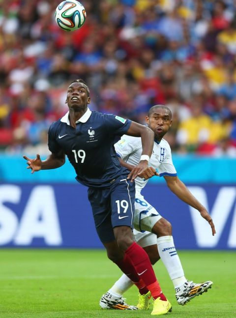 PORTO ALEGRE, BRAZIL - JUNE 15:  Wilson Palacios of Honduras fouls Paul Pogba of France resulting in a penalty kick during the 2014 FIFA World Cup Brazil Group E match between France and Honduras at Estadio Beira-Rio on June 15, 2014 in Porto Alegre, Brazil.  (Photo by Jeff Gross/Getty Images)