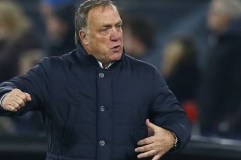 Fenerbahce's coach Dick Advocaat gestures during the Group A Europa League soccer match between Feyenoord and Fenerbahce at De Kuip stadium in Rotterdam, Thursday, Dec. 8, 2016. (AP Photo/Peter Dejong)
