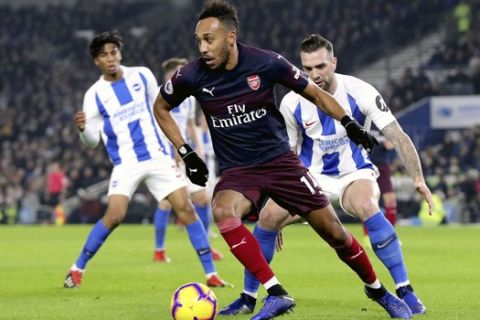 Arsenal's Pierre-Emerick Aubameyang in action during the English Premier League soccer match against Brighton at the AMEX Stadium, Brighton, Wednesday Dec. 26, 2018. (Gareth Fuller/PA via AP)