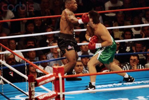 19 Aug 1995, Las Vegas, Nevada, USA --- Mike Tyson (left) throws a right upper cut at Peter "Hurricane" McNeeley, sending him to the canvas seconds later, during their bout at the MGM Grand in Las Vegas, Nevada. --- Image by © Michael Brennan/CORBIS
