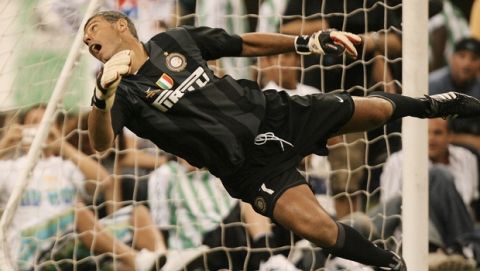 Goalkeeper Francesco Toldo makes a diving attempt on a shot gone wide during the Free Kick Masters competition Saturday, July 5, 2008, in Houston. (AP Photo/Bob Levey)