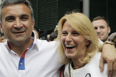Serbia's Novak Djokovic's father Srdan and mother Dijana celebrate after he defeated Spain's Rafael Nadal in the men's singles final at the All England Lawn Tennis Championships at Wimbledon, Sunday, July 3, 2011. (AP Photo/Anja Niedringhaus)