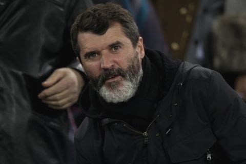 Roy Keane, assistant manager of the Republic of Ireland national football team, takes his seat before the English Premier League soccer match between Everton and Queens Park Rangers at Goodison Park Stadium, Liverpool, England, Monday Dec. 15, 2014. (AP Photo/Jon Super)