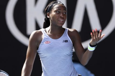 Coco Gauff of the U.S. reacts after losing a point to compatriot Sofia Kenin during their fourth round singles match at the Australian Open tennis championship in Melbourne, Australia, Sunday, Jan. 26, 2020. (AP Photo/Andy Brownbill)
