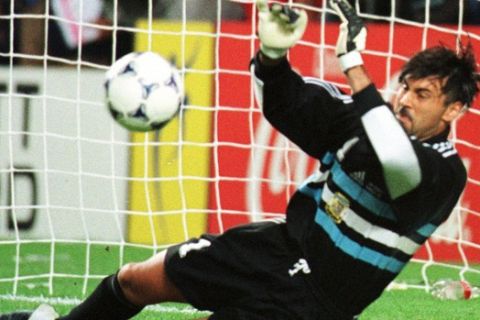 Argentine goalkeeper Carlos Roa saves a penalty kicked by English Paul Ince in a penalties definition during the England vs Argentina second round World Cup 98, soccer match at Geoffroy Guichard Stadium in Saint Etienne, Tuesday, June 30, 1998. Argentina knocked England out of the World Cup 4-3 on penalties Tuesday to advance to the quarterfinal after the two teams had tied 2-2 after extra time. (AP Photo/Eric Draper)