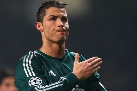 MANCHESTER, ENGLAND - MARCH 05:  Cristiano Ronaldo of Real Madrid salutes the crowd at the end of the UEFA Champions League Round of 16 Second leg match between Manchester United and Real Madrid at Old Trafford on March 5, 2013 in Manchester, United Kingdom.  (Photo by Alex Livesey/Getty Images)