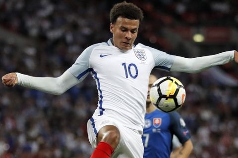 England's Dele Alli controls the ball during the World Cup Group F qualifying soccer match between England and Slovakia at Wembley Stadium in London, England, Monday, Sept. 4, 2017. (AP Photo/Kirsty Wigglesworth)
