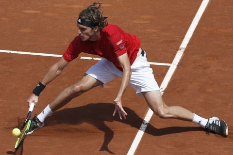 Stefanos Tsitsipas of Greece returns the ball in his semifinal match against Spain's Pablo Carreno Busta during the Barcelona Open Tennis Tournament in Barcelona, Spain, Saturday, April 28, 2018. (AP Photo/Manu Fernandez)