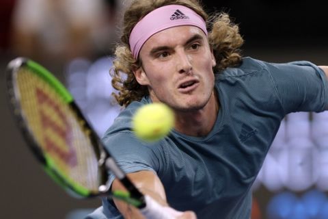 Stefanos Tsitsipas of Greece returns the ball to Mikhail Kukushkin of Kazakhstan during their final match at the Open 13 Provence tennis tournament in Marseille, southern France, Sunday Feb.24, 2019.(AP Photo/Claude Paris)